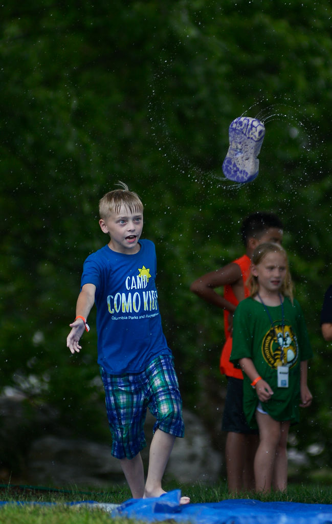 Kolton Kelly, 9, throws a soap-drenched sponge at a fellow camper